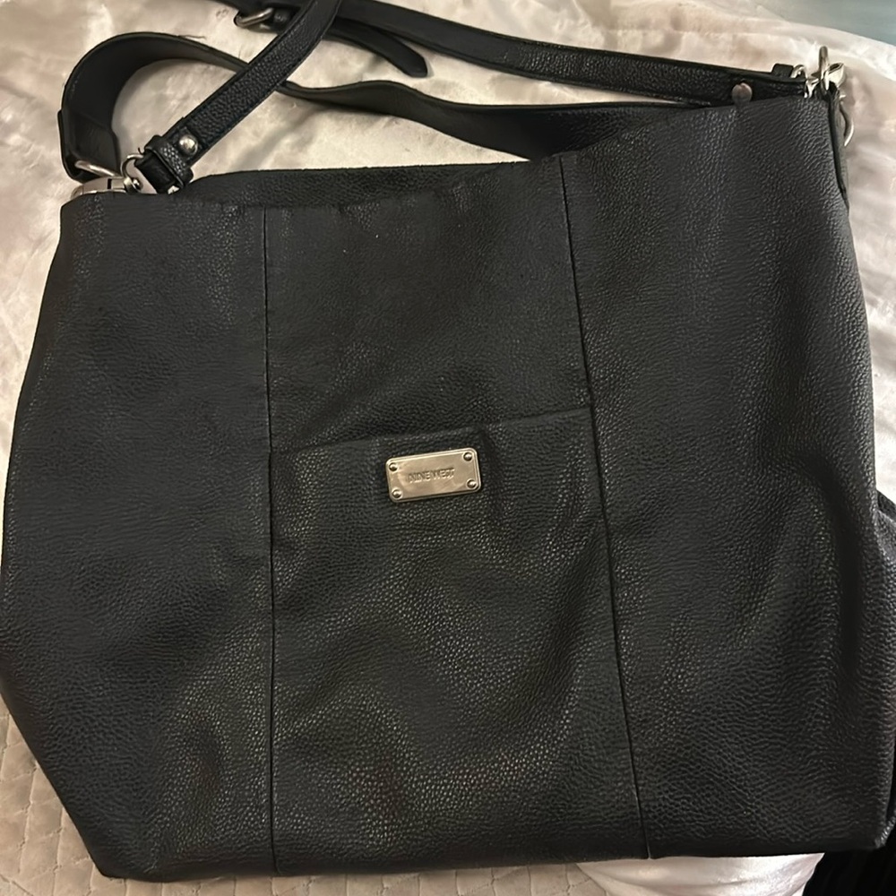 Black leather durable Nine West hand bag.